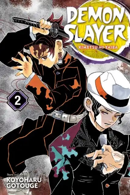 Engelstalige cover van Demon Slayer: Kimetsu no Yaiba Vol. 2, met Tanjiro Kamado en Nezuko Kamado in een actievolle scène, waarin ze samen strijden tegen demonen, getekend in een expressieve en gedetailleerde manga-stijl.